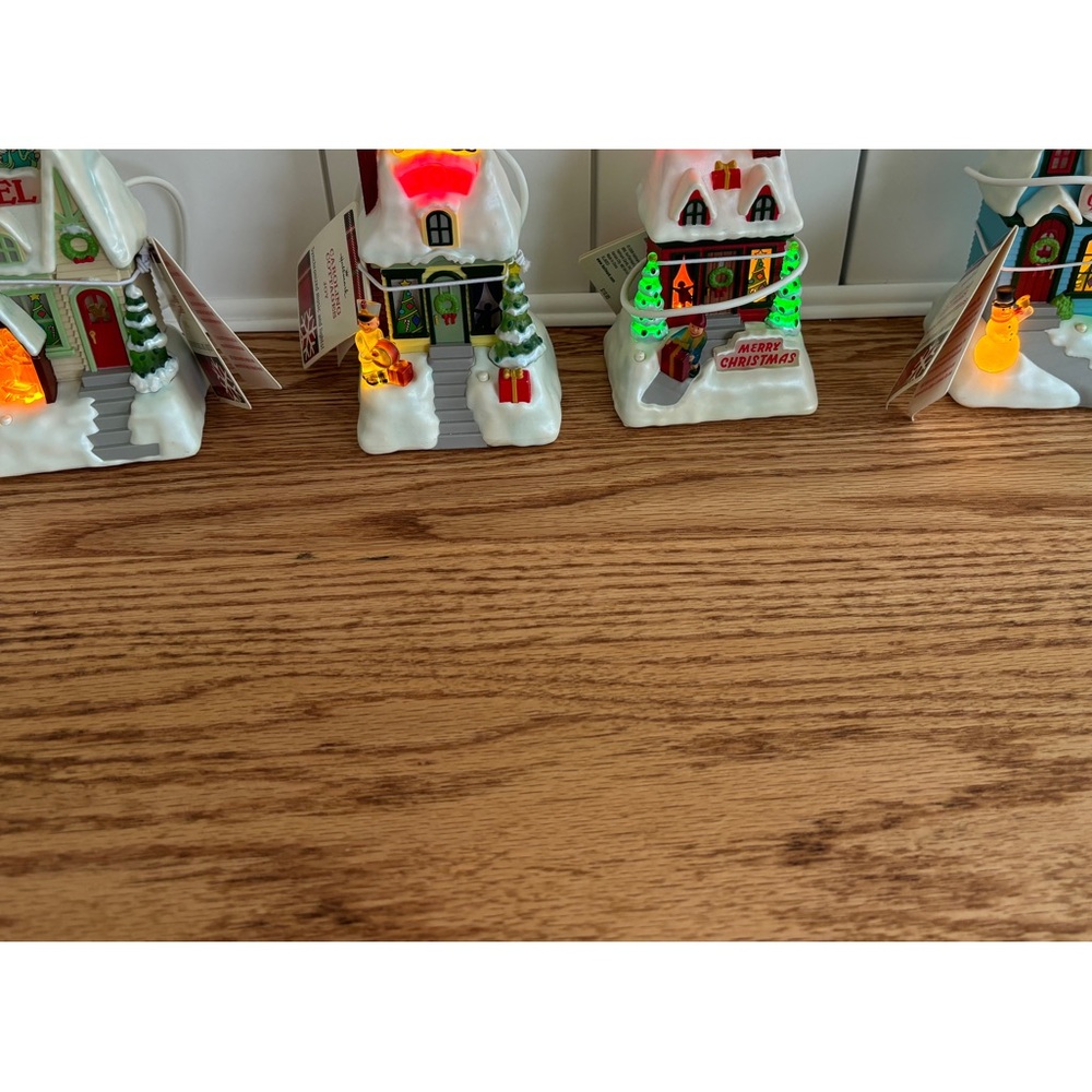 Caroling cottages. Music,lights,interactive. Hallmark.